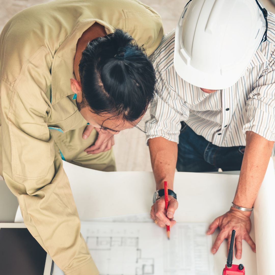 Engineers working on plans