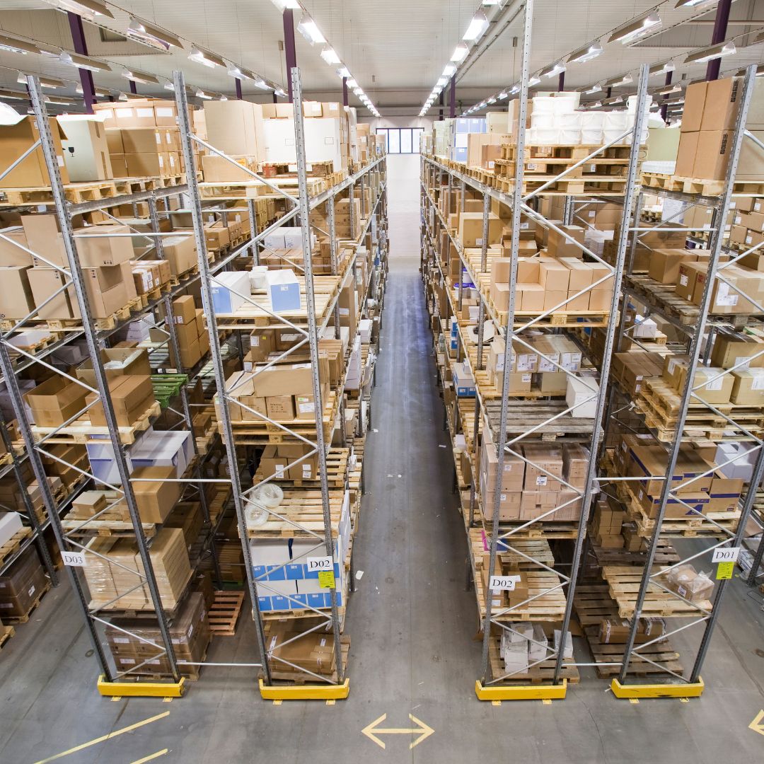 boxes stacked on tall shelves