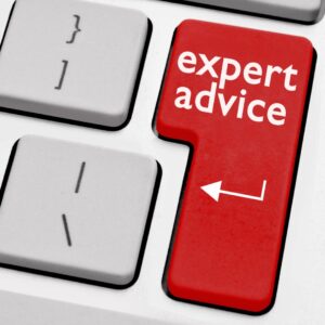 Keyboard where a red key says "expert advice"